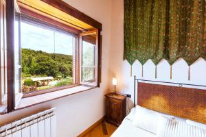 Postel nebo postele na pokoji v ubytování Agriturismo & Cantina Tenuta Casteani