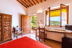 Postel nebo postele na pokoji v ubytování Agriturismo & Cantina Tenuta Casteani