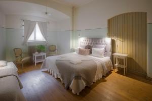 Postel nebo postele na pokoji v ubytování Kastellet Bed & Breakfast