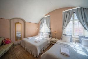 เตียงในห้องที่ Kastellet Bed & Breakfast