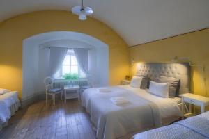 Postel nebo postele na pokoji v ubytování Kastellet Bed & Breakfast