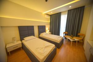 Postel nebo postele na pokoji v ubytování Hotel Elesio