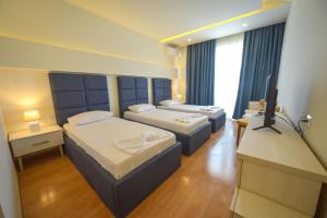 Postel nebo postele na pokoji v ubytování Hotel Elesio