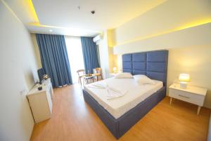 Postel nebo postele na pokoji v ubytování Hotel Elesio