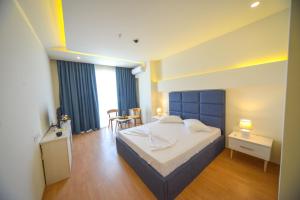 Postel nebo postele na pokoji v ubytování Hotel Elesio