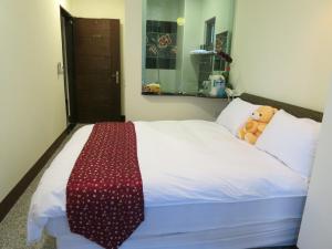 Postel nebo postele na pokoji v ubytování Sun Moon Lake Crown Yu Hotel
