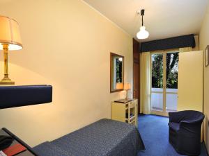 Postel nebo postele na pokoji v ubytování Hotel & Residence Dei Duchi