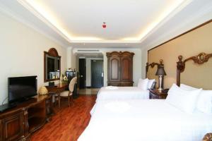 LK Miracle Suite - SHA Extra Plus客房内的一张或多张床位