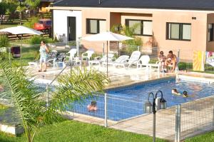 a group of people in a swimming pool at Complejo Reencuentro in Colón