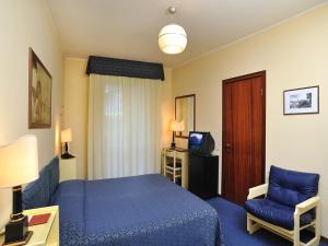 Postel nebo postele na pokoji v ubytování Hotel & Residence Dei Duchi