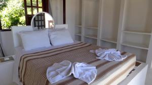 Katil atau katil-katil dalam bilik di Condomínio Mar Aberto