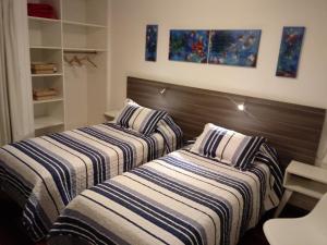 מיטה או מיטות בחדר ב-La Magdalena
