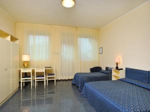 Postel nebo postele na pokoji v ubytování Hotel & Residence Dei Duchi