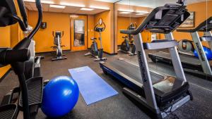 a gym with a treadmill and exercise equipment at Best Western Hazlet Inn in Hazlet