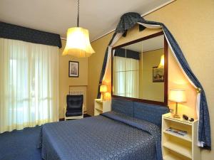 Postel nebo postele na pokoji v ubytování Hotel & Residence Dei Duchi