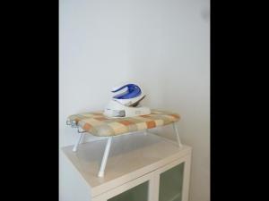 a table with a blender on top of a stool at Nagoya Motoyama House C in Nagoya