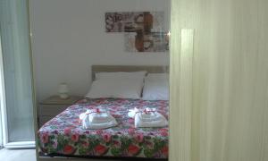 Postel nebo postele na pokoji v ubytování Residenza Somma