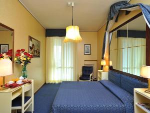 Postel nebo postele na pokoji v ubytování Hotel & Residence Dei Duchi