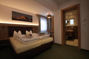 Postel nebo postele na pokoji v ubytování Lärchenheim Apartments
