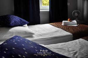 Posteľ alebo postele v izbe v ubytovaní Lublin Old Town Rooms