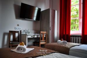 Posteľ alebo postele v izbe v ubytovaní Lublin Old Town Rooms