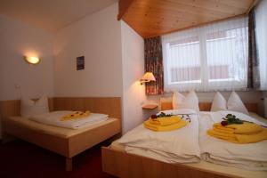Postel nebo postele na pokoji v ubytování Lärchenheim Apartments