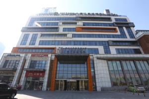 a large office building with a lot of windows at Metropolo, Langfang, Wanda Plaza-Ningyuan Park in Langfang
