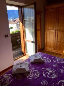 Postel nebo postele na pokoji v ubytování Albergo Meuble Tarandan