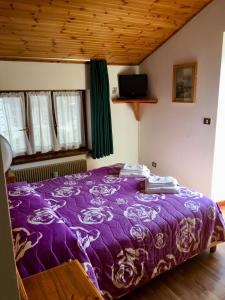 Postel nebo postele na pokoji v ubytování Albergo Meuble Tarandan