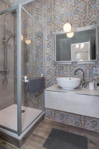 a bathroom with a sink and a shower at City Center Rooms in Dubrovnik