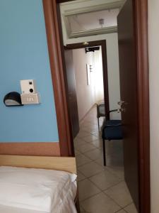 A bed or beds in a room at Hotel Penny