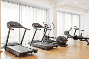 a gym with a bunch of exercise bikes in a room at Sunprime Protaras Beach - Adults Only in Protaras