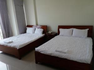 Postel nebo postele na pokoji v ubytování Motel Bao Linh