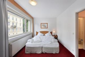 Ліжко або ліжка в номері Am Neutor Hotel Salzburg Zentrum +37 фото