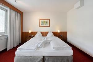 En eller flere senger på et rom på Am Neutor Hotel Salzburg Zentrum