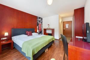 En eller flere senger på et rom på Am Neutor Hotel Salzburg Zentrum
