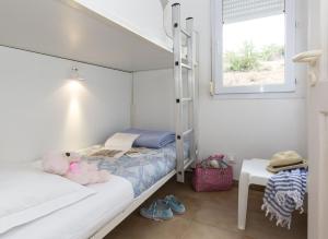 Postel nebo postele na pokoji v ubytování Résidence Odalys Stella di l'Aria + 29 fotografií