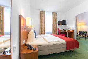Postel nebo postele na pokoji v ubytování Hotel Weierich