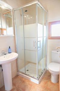 a bathroom with a shower and a toilet and a sink at Ca Na Maria Teueta in San Ferrán de ses Roques +43 photos