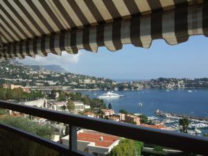 a view of the water from a balcony at L'Agrianthe in Villefranche-sur-Mer