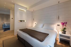 Postel nebo postele na pokoji v ubytování Hotel Astoria