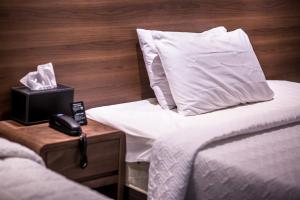 Postel nebo postele na pokoji v ubytování Hotel Egg