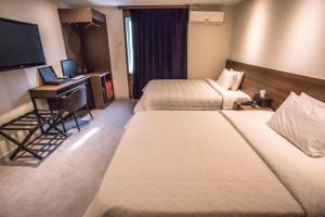 Postel nebo postele na pokoji v ubytování Hotel Egg