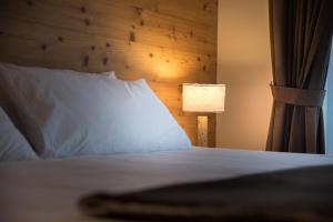 Postel nebo postele na pokoji v ubytování Hotel Astoria