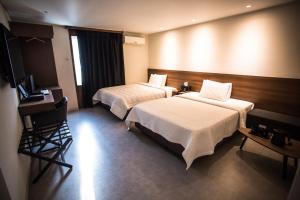 Postel nebo postele na pokoji v ubytování Hotel Egg