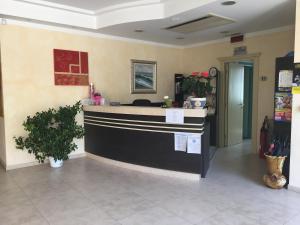 a lobby of a restaurant with a counter in a room at Residence Levante in Misano Adriatico
