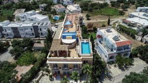 an aerial view of a building with a swimming pool at Porto Plakias & Spa in Plakias