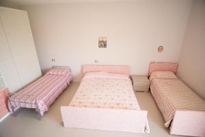 A bed or beds in a room at Casa Vacanza Dal Cavaliere