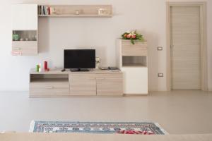 A television and/or entertainment centre at Casa Vacanza Dal Cavaliere
