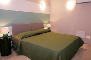 Postel nebo postele na pokoji v ubytování Il Convento Case Vacanze